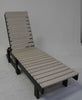 Modern straight chaise lounge with adjustable backrest and slatted surface for outdoor use